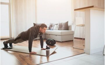 man doing plank training at home