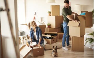 couple unpacking moving boxes