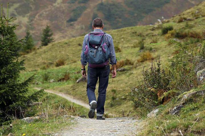 man walking in field