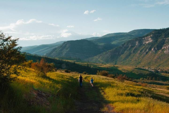 colorado landscape with two people walking