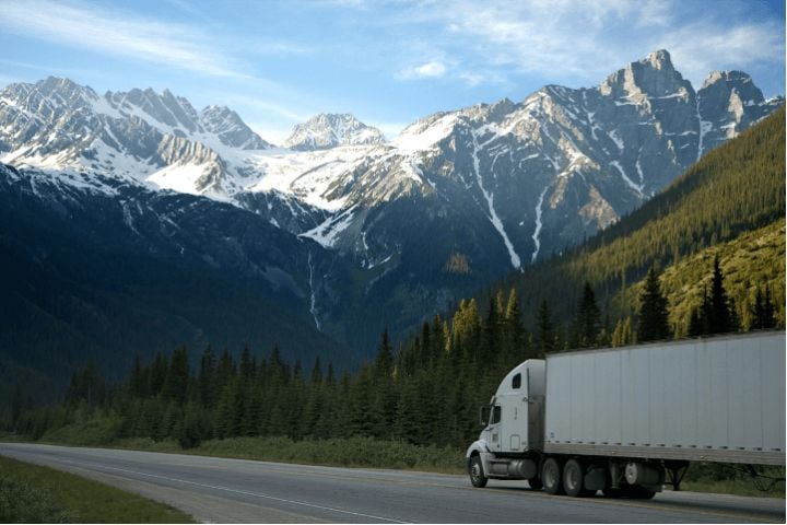 moving truck through snowy mountains