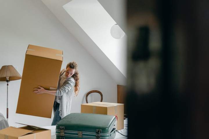 woman moving moving box