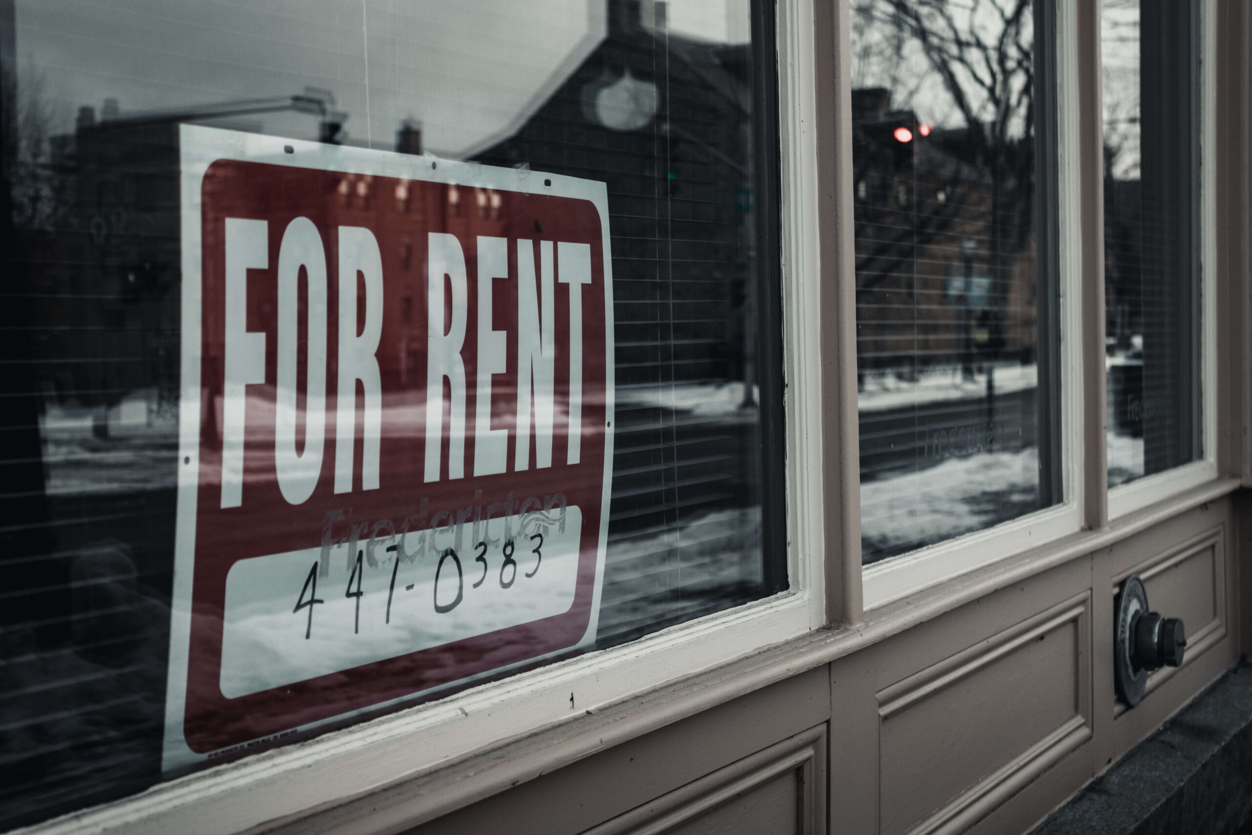 window with for rent sign