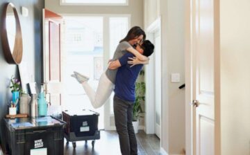 couple hugging recently moved house