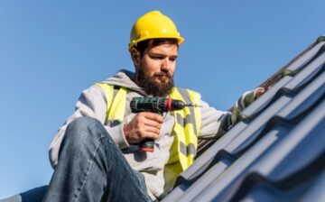 man working on roof repair