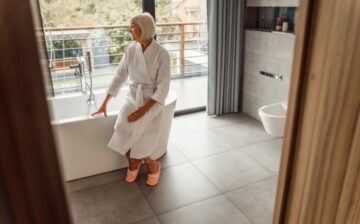 woman sitting in bath tub