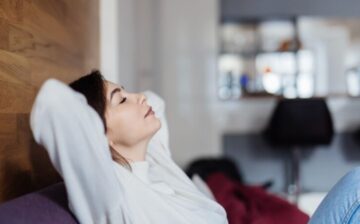 Woman breathing good quality air at home