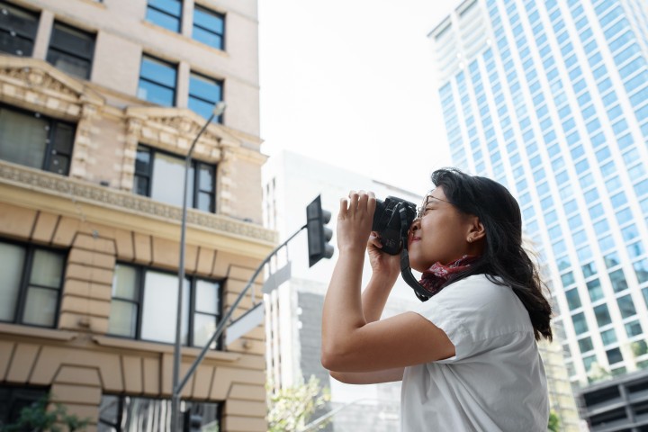 real estate woman taking photos of properties