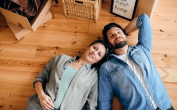 view couple lying down floor their new home