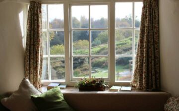 window with seat and cushions