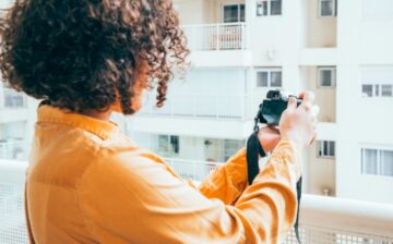 Woman taking photo of real estate property in Denver