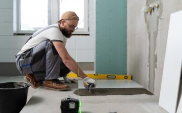 man working on bathroom renovation