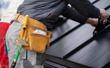 man working on roof maintenance