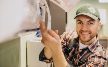 repairman doing air conditioner service