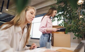 women working in moving office