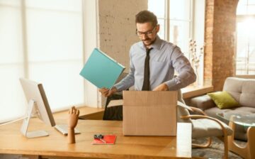 young businessman moving office getting new work place