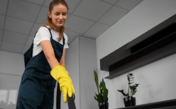 medium shot woman cleaning indoors