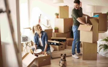 couple packing moving boxes