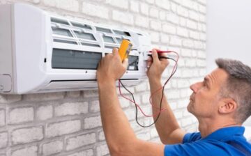 man fixing air conditioning