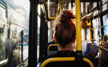 female sitting in a bus