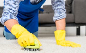 man cleaning his rug