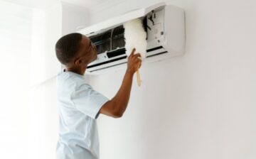 man cleaning the air conditioner