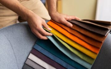 man selecting sofa fabric