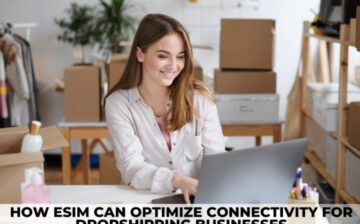 woman working on computer with boxes in background