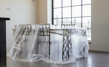 Dining Table and Chairs Covered with Plastic