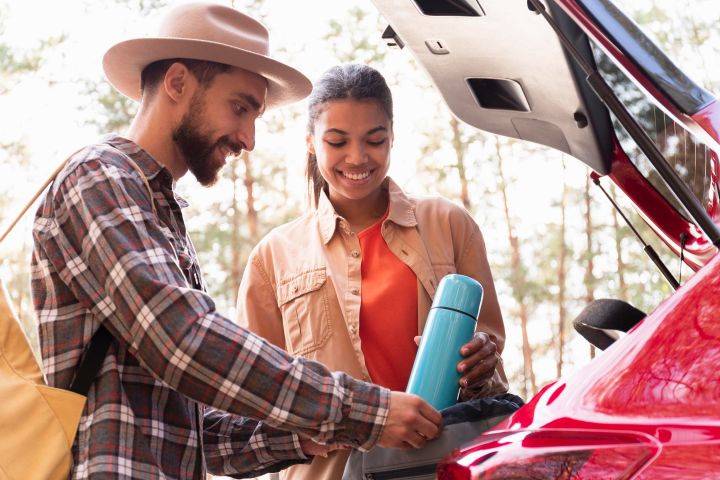 couple loading the car on moving day