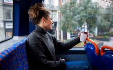 young woman riding bus city to nyc