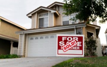 house with sold yard sign