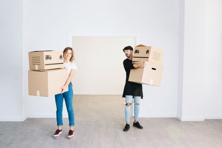 moving concept with couple holding